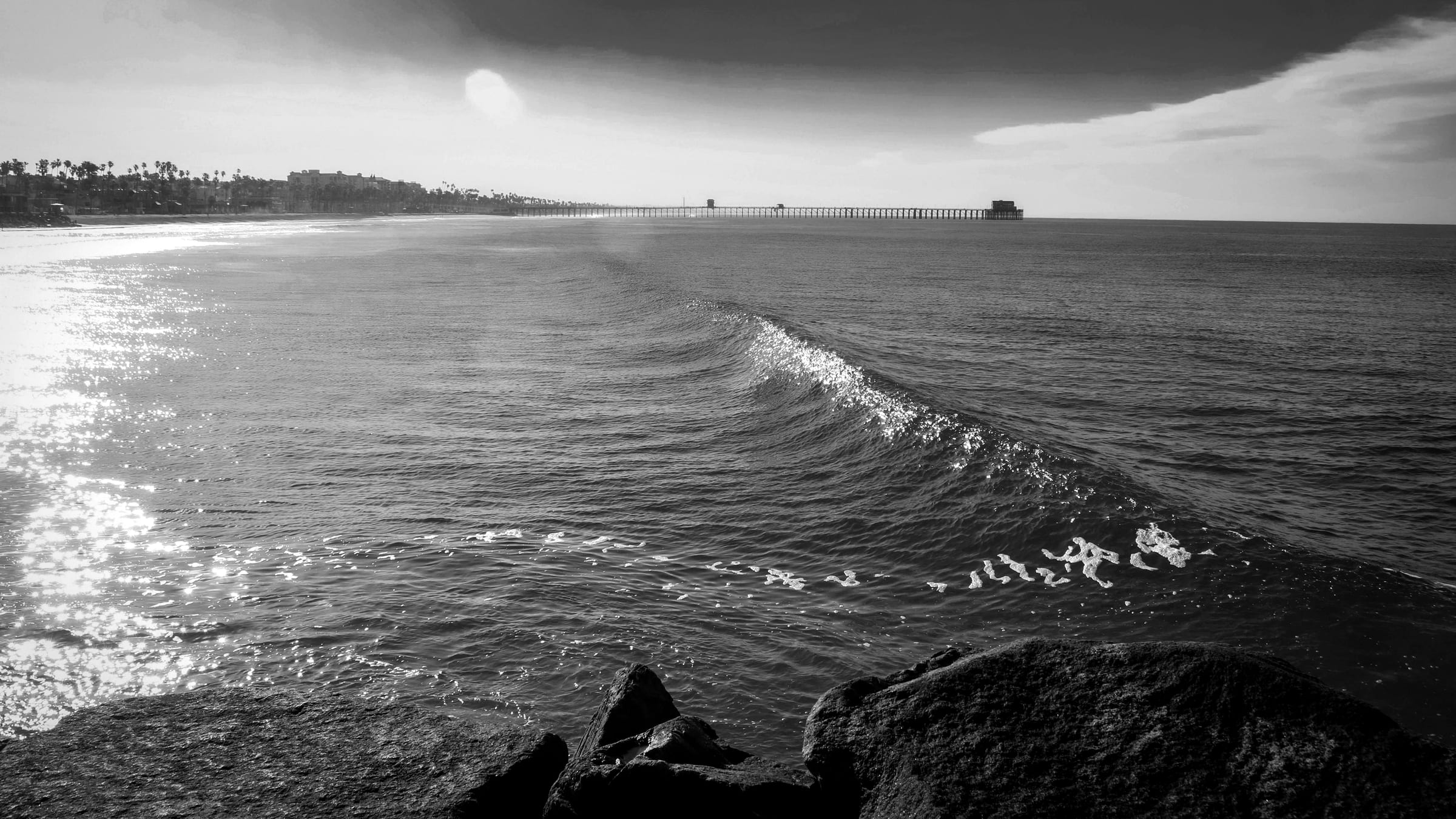 Black-and-white view of the pier at Pier South, Oceanside.